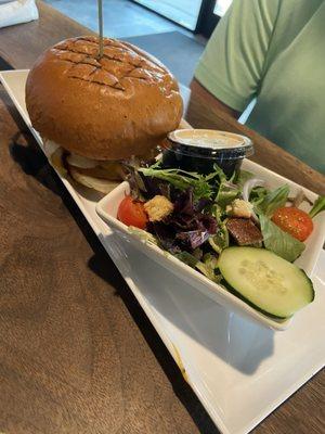 Chicken sandwich with side salad.