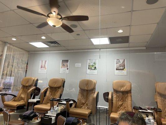 Pedicure area with plenty of chairs and room