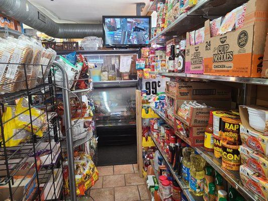 Merchandise, carryout counter, and security monitor.