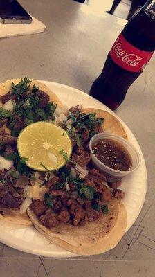 Dos tacos de Carne Asada y Lengua con una Coca fria.  So delicious!