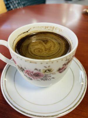 Turkish coffee. Was beautiful creama. But I stirred sugar in.