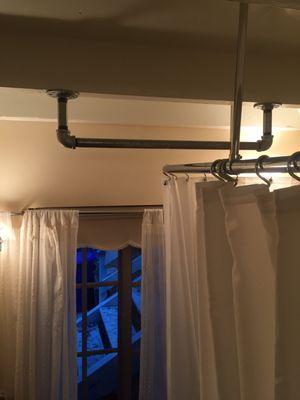 24" x 3/4" galvanized pipe grab bar to help with safely stepping from a claw-tub bathtub/shower.