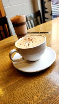 Eggnog latte on a clean, spacious table