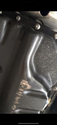 Missing under plate guard, dented oil pan