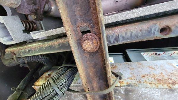 One of the multiple bolts that fasten the generator to the chassis.