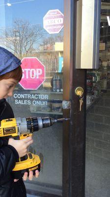 My Son Learning How To Install A Lock