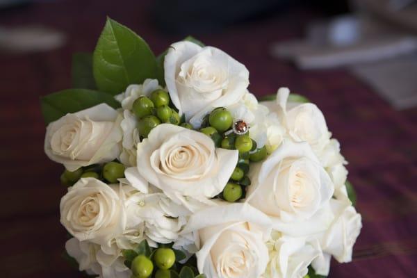 My bouquet. Primarily roses. Hydrangeas small and squished down