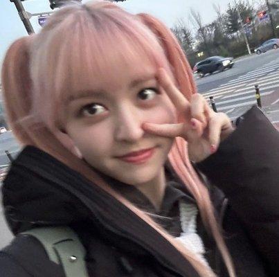 Lily Morrow, K-pop idol, Peace sign, Pink Pigtails, Jacket.