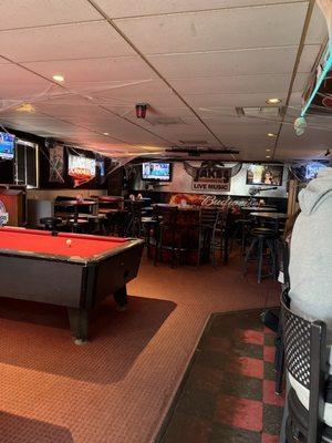 Pool tables sitting area tv's