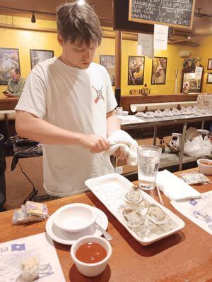 Jack shucking fresh oysters for us. Soo good!!