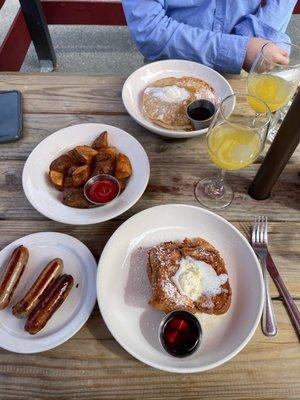 French toast, side of sausage, side of Cajun home style potatoes, buttermilk pancakes, mimosas