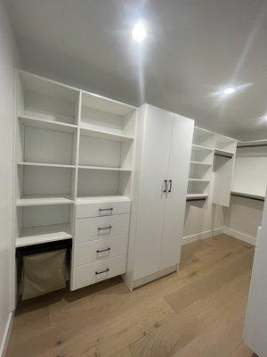 Great white closet with deep full height doors section