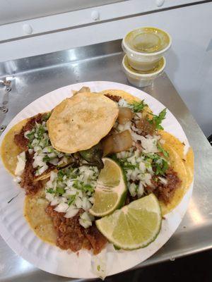 4 tacos de tripa,  onions, cilantro,  nopales, caramelized onions,  a tostada , and salsa verde, $7