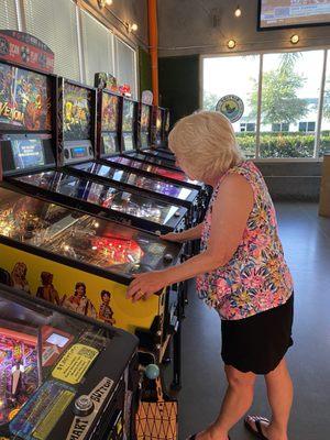 Pinball machines with beer holders!