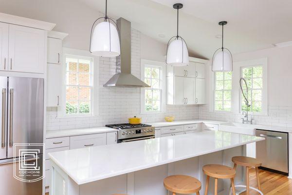 Franklin St. Chapel Hill - Shaker White Cabinets with Large Seating at Island and Milk Glass Pendants