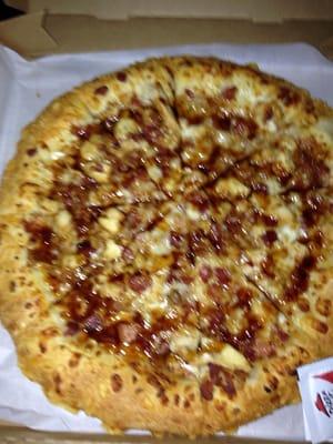 Chicken and bacon on has tossed asiago crust drizzled with BBQ