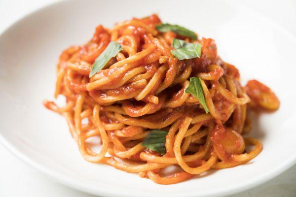 Spaghetti pomodoro with fresh basil.