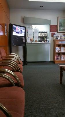 A view of the front desk from the tiny waiting room.