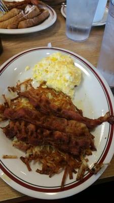 Eggs whites with cheese bacon over hash browns. ..yummy