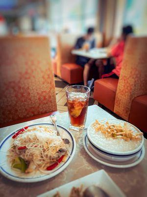 breakfast set with congee, fried rice noodle and a ice lemon tea drink