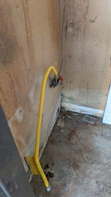 Gas pipe left after water tank removal.