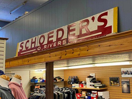 An older sign is preserved inside the store. The "R" is missing from Schroeder's.