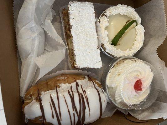 Key lime tart, tres leches cake, eclair and something else