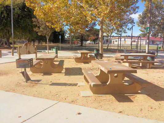 Picnic tables with BBQ pits