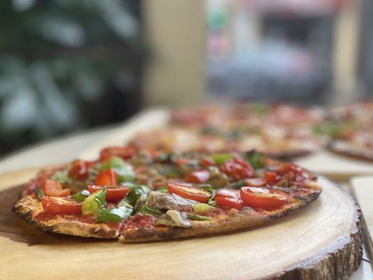 Veggie Pizza, cherry tomatoes, red peppers, spinach, oyster mushrooms, basil