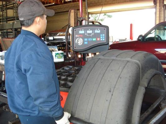 Mechanic Joey on the computer tire balancing machine