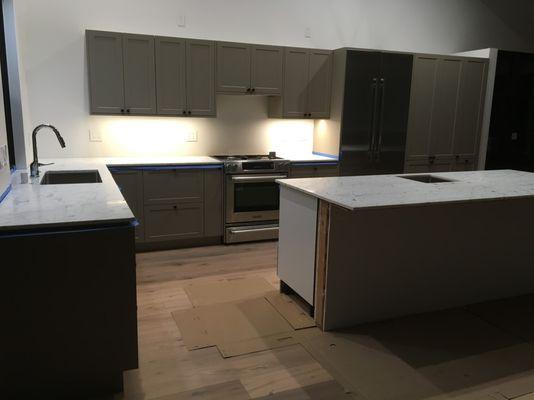 new marble kitchen counters and island.