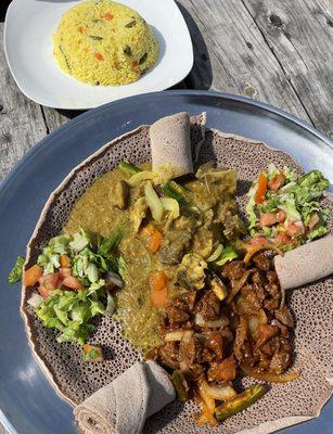 Veggie rice , beef tibs and goat akikl, injera flat bread and Ethiopian salad