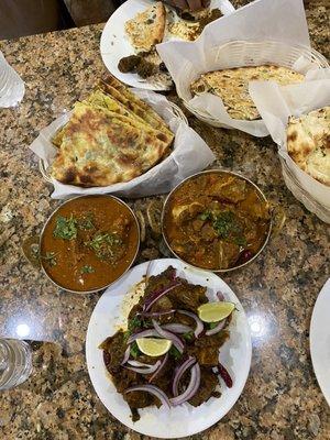 Goat Curry (12 OZ) & Garlic Naan, Potato Spicy Masala Kulcha, Chicken Bone In Curry (12 oz) & Plain Naan