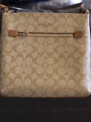 Classic, neutral Coach purse.