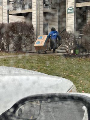 Paul with the large boxes even in the rain.