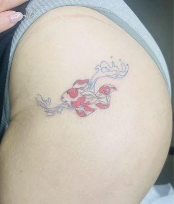 A Koi fish drawing done by my daughter and tattoed by Sandra.