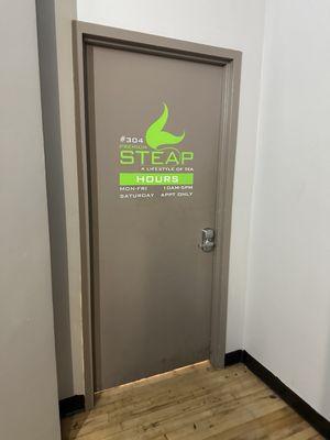 Door to tea shop within office building