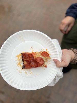 Half of a pepperoni slice.