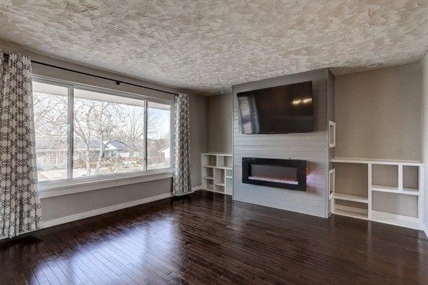 Family room with electric fireplace & custom built-ins.