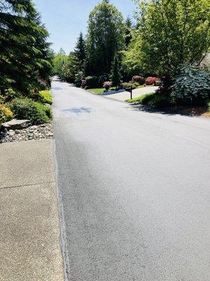 Finished neighborhood sealed road on the same street.