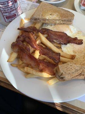 Two egg bacon wit fries. Comes with 3 strips of bacon*