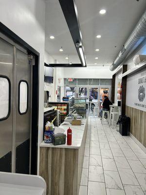 Entrance and counter with doughnuts