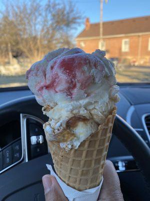 Strawberry cheesecake and Tennessee toffee in a waffle cone. 2 scoops is a medium.