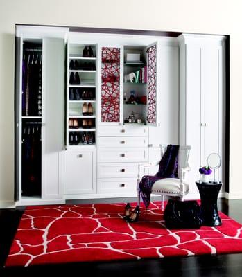 Custom wardrobe unit in bellisima white featuring ecoresin inserts, glass shelves & shoe rails