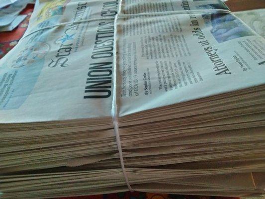 My neat pile of newspapers delivered after return from my vacation!