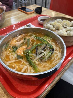 Two mussels and two shrimps in the seafood noodle soup