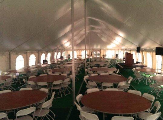 40 x 100 pole tent. With window walls. 72" round tables. And white plastic chairs.