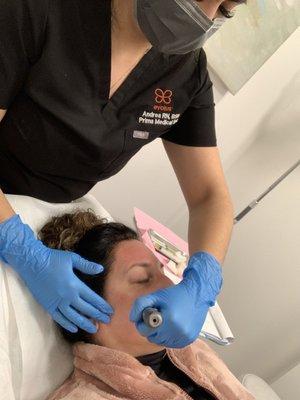 Mrs. Andrea doing her thing.  PRP treatment.