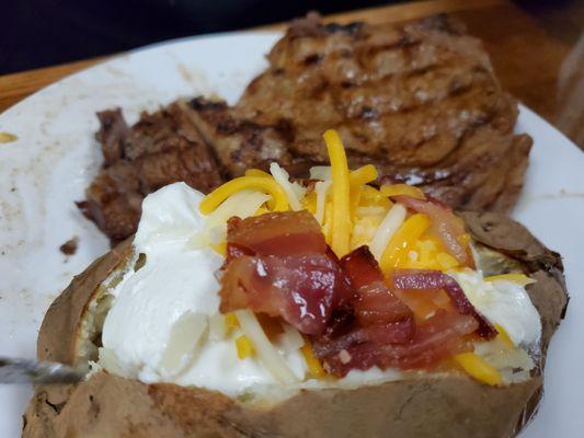 14 Oz ribeye with loaded potato