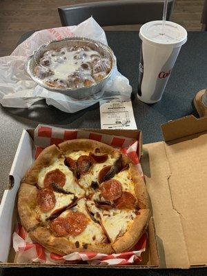 Pizza, cinnamon monkey bread, coke and receipt.